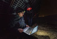 National Renewable Energy Laboratory (NREL) researchers Tim Silverman and Nicole Luna look over data generated by PLatypus, which was connected to a photovoltaics system on the Flatirons campus.