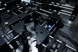A closeup of the blue laser setup for generating entangled photon pairs in NTU Singapore’s experiments.